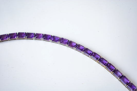 Deep purple emerald-cut gemstone tennis bracelet in 925 silver