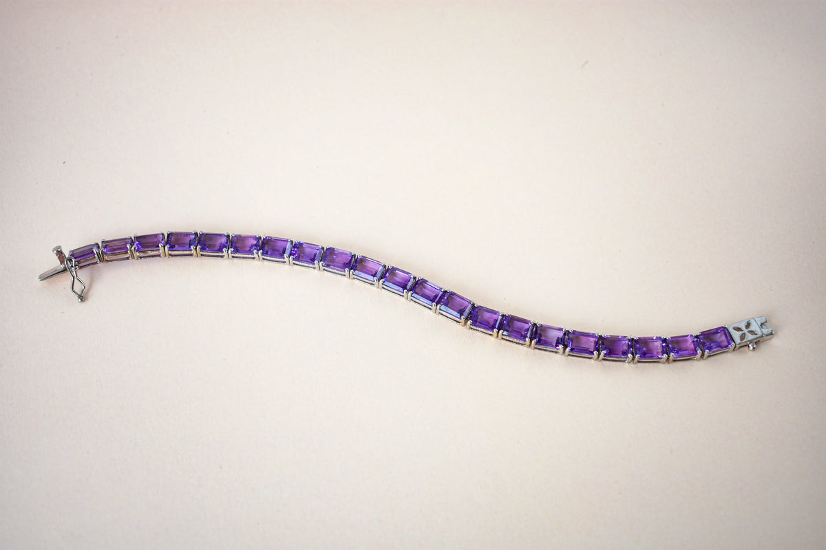 Deep purple emerald-cut gemstone tennis bracelet in 925 silver