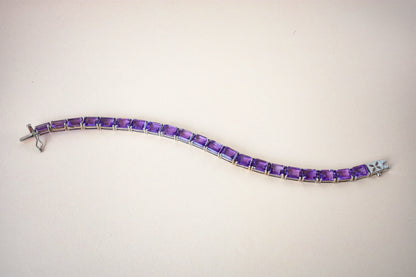 Deep purple emerald-cut gemstone tennis bracelet in 925 silver