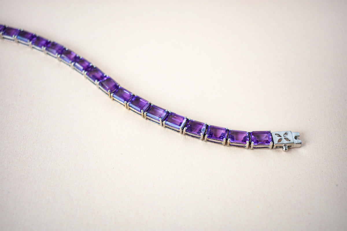 Deep purple emerald-cut gemstone tennis bracelet in 925 silver