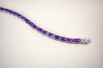 Deep purple emerald-cut gemstone tennis bracelet in 925 silver