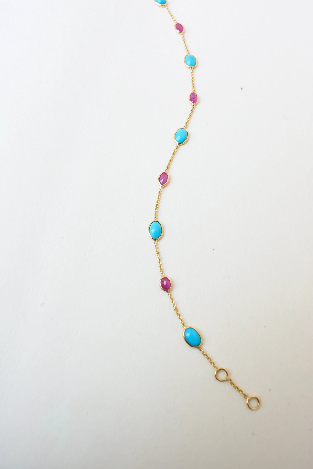 18K gold bracelet with turquoise and ruby stations