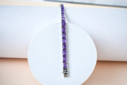 Deep purple emerald-cut gemstone tennis bracelet in 925 silver