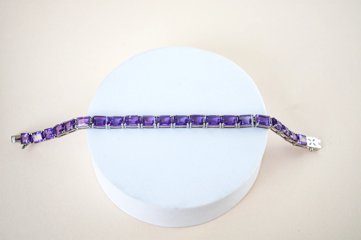 Deep purple emerald-cut gemstone tennis bracelet in 925 silver