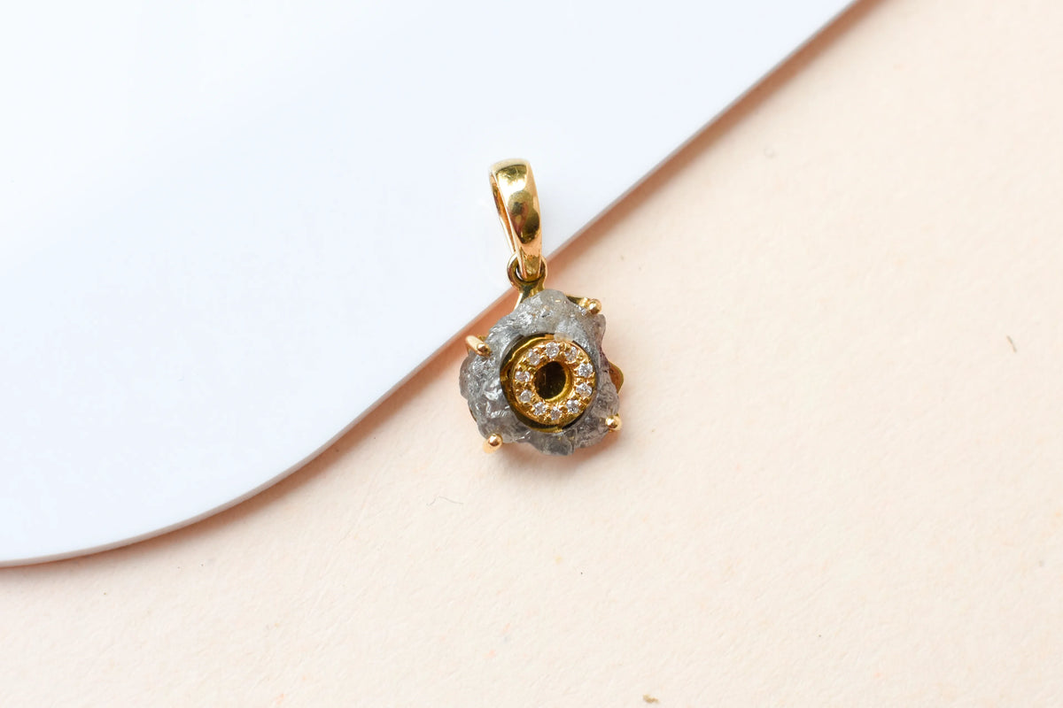 18K gold pendant with rough diamond crystal and pavé diamond halo