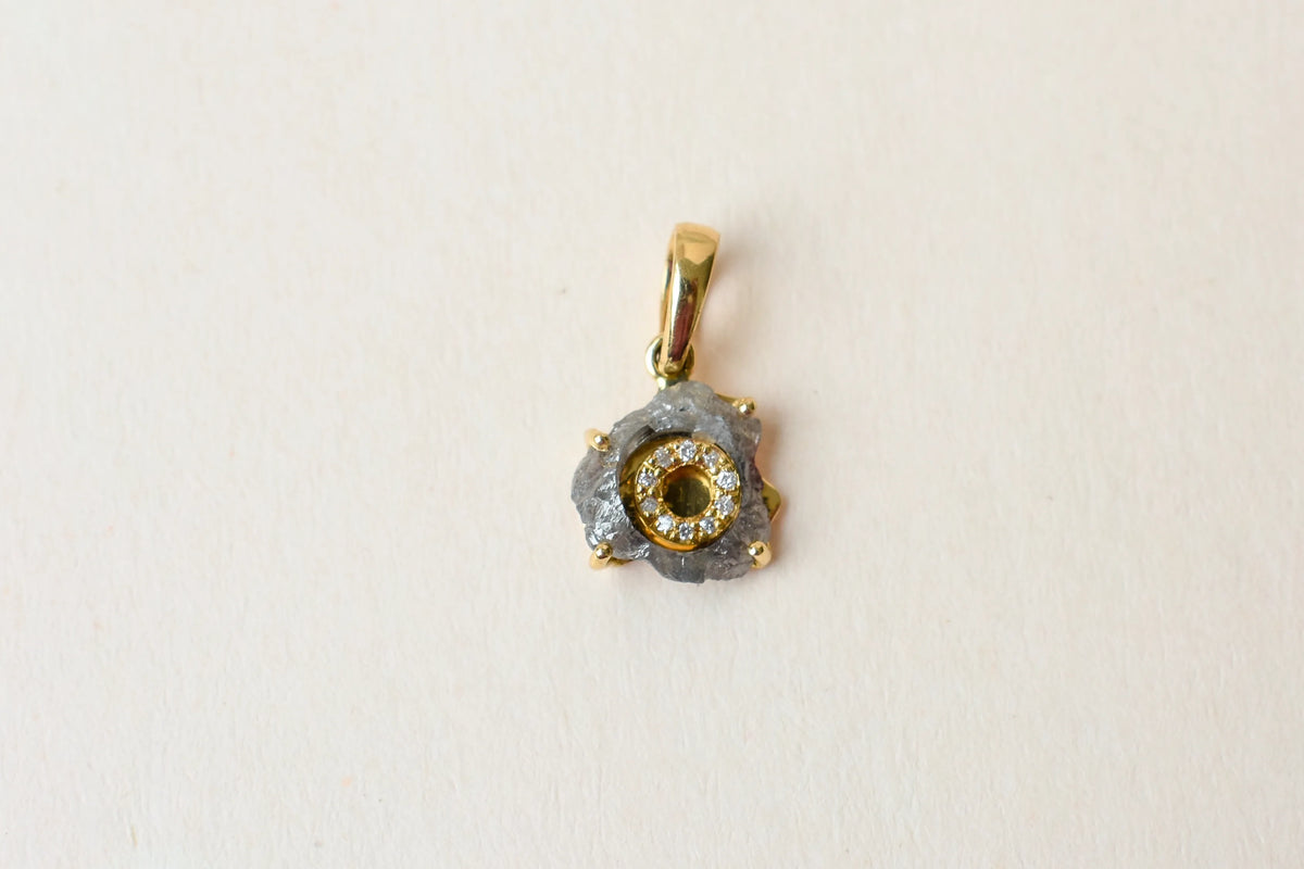 18K gold pendant with rough diamond crystal and pavé diamond halo
