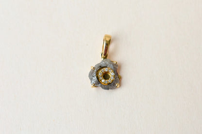 18K gold pendant with rough diamond crystal and pavé diamond halo