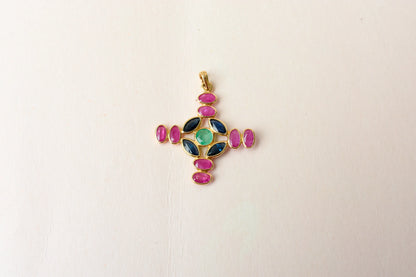 18K gold cross pendant with ruby, sapphire, and emerald