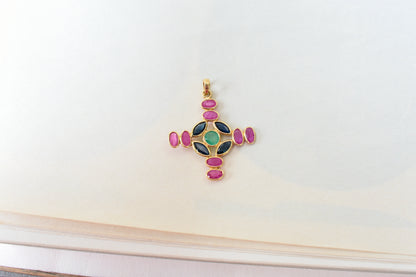 18K gold cross pendant with ruby, sapphire, and emerald