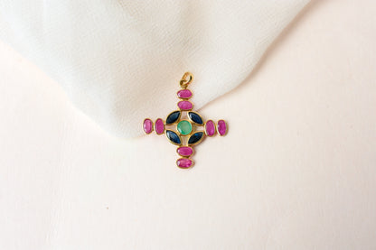 18K gold cross pendant with ruby, sapphire, and emerald