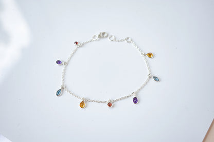 Multi gemstone dangle bracelet with pear-cut colored stones on a 925 silver chain
