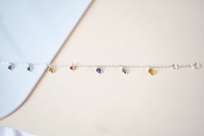 Multi gemstone dangle bracelet with pear-cut colored stones on a 925 silver chain