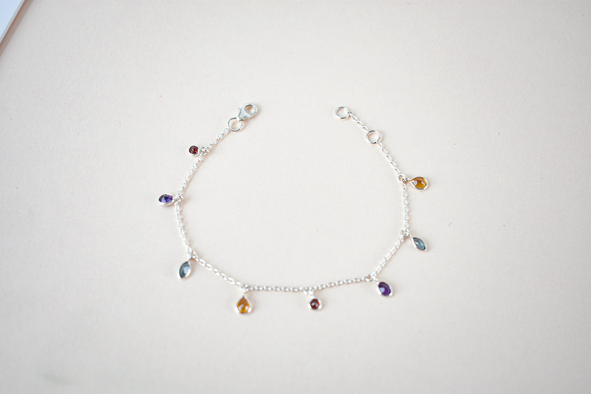Multi gemstone dangle bracelet with pear-cut colored stones on a 925 silver chain