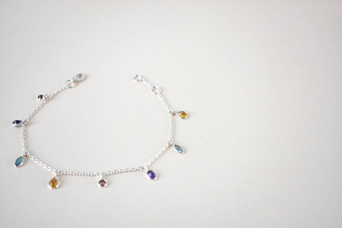 Multi gemstone dangle bracelet with pear-cut colored stones on a 925 silver chain
