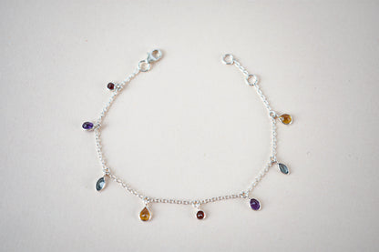 Multi gemstone dangle bracelet with pear-cut colored stones on a 925 silver chain