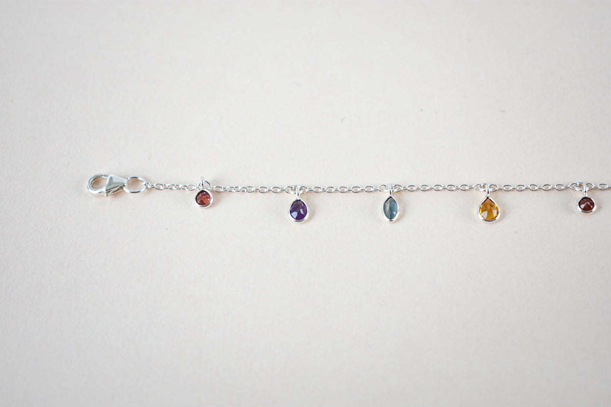 Multi gemstone dangle bracelet with pear-cut colored stones on a 925 silver chain
