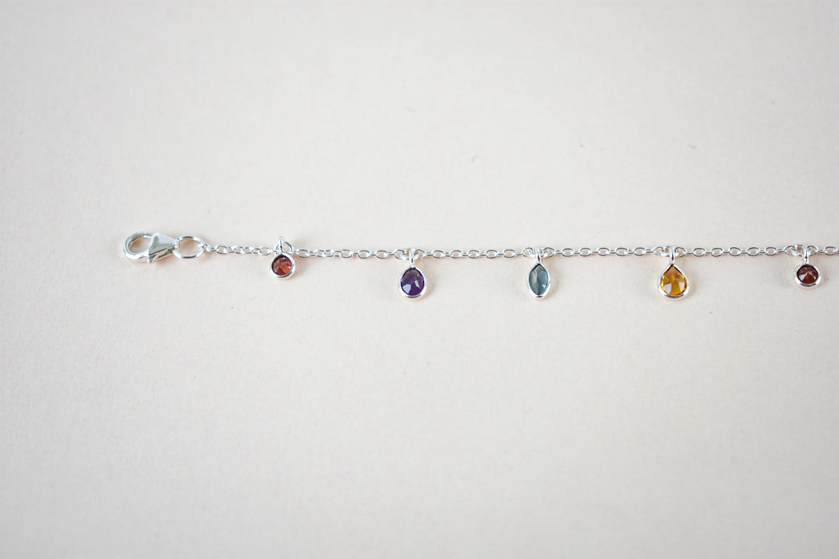 Multi gemstone dangle bracelet with pear-cut colored stones on a 925 silver chain
