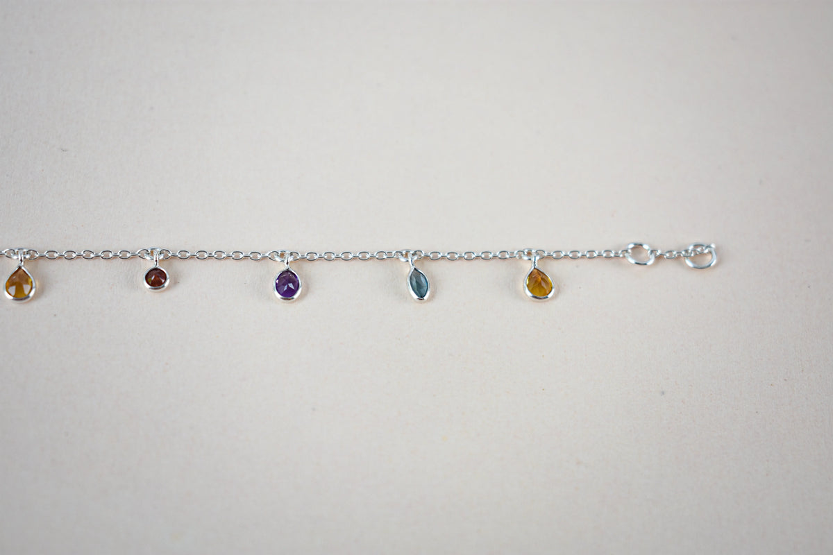 Multi gemstone dangle bracelet with pear-cut colored stones on a 925 silver chain