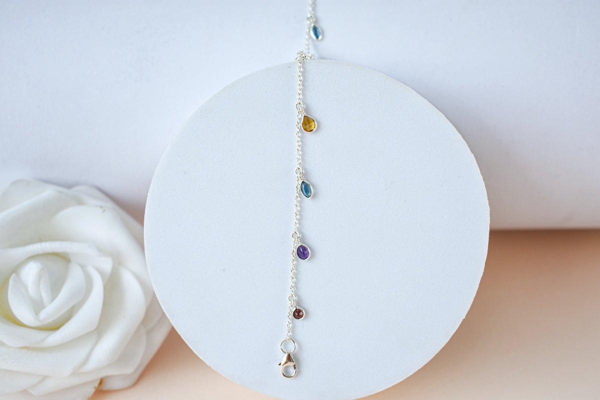 Multi gemstone dangle bracelet with pear-cut colored stones on a 925 silver chain