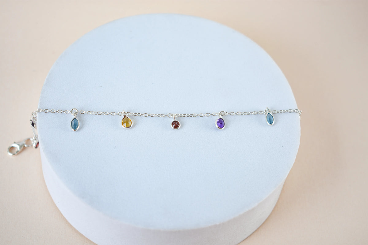 Multi gemstone dangle bracelet with pear-cut colored stones on a 925 silver chain