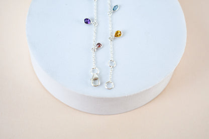 Multi gemstone dangle bracelet with pear-cut colored stones on a 925 silver chain