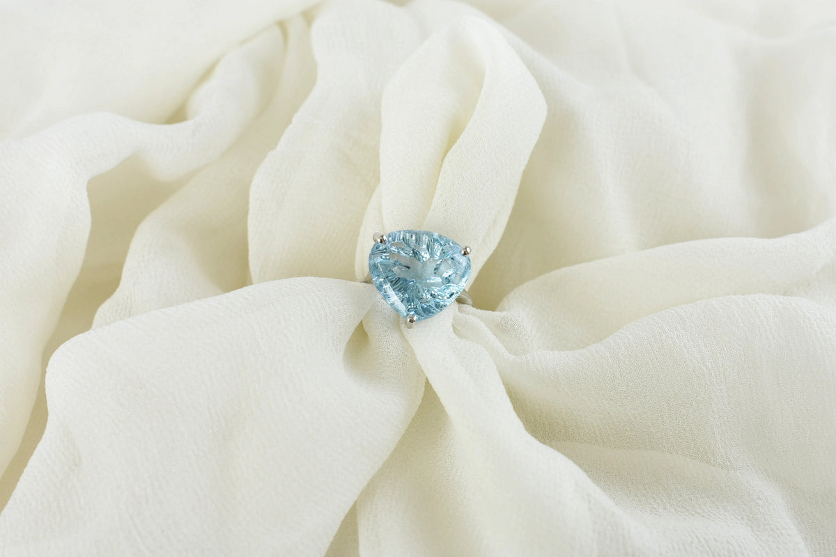 Sky blue topaz trillion-cut solitaire ring in 925 silver