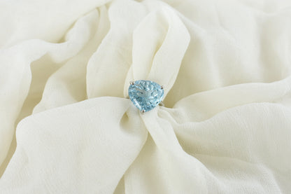 Sky blue topaz trillion-cut solitaire ring in 925 silver