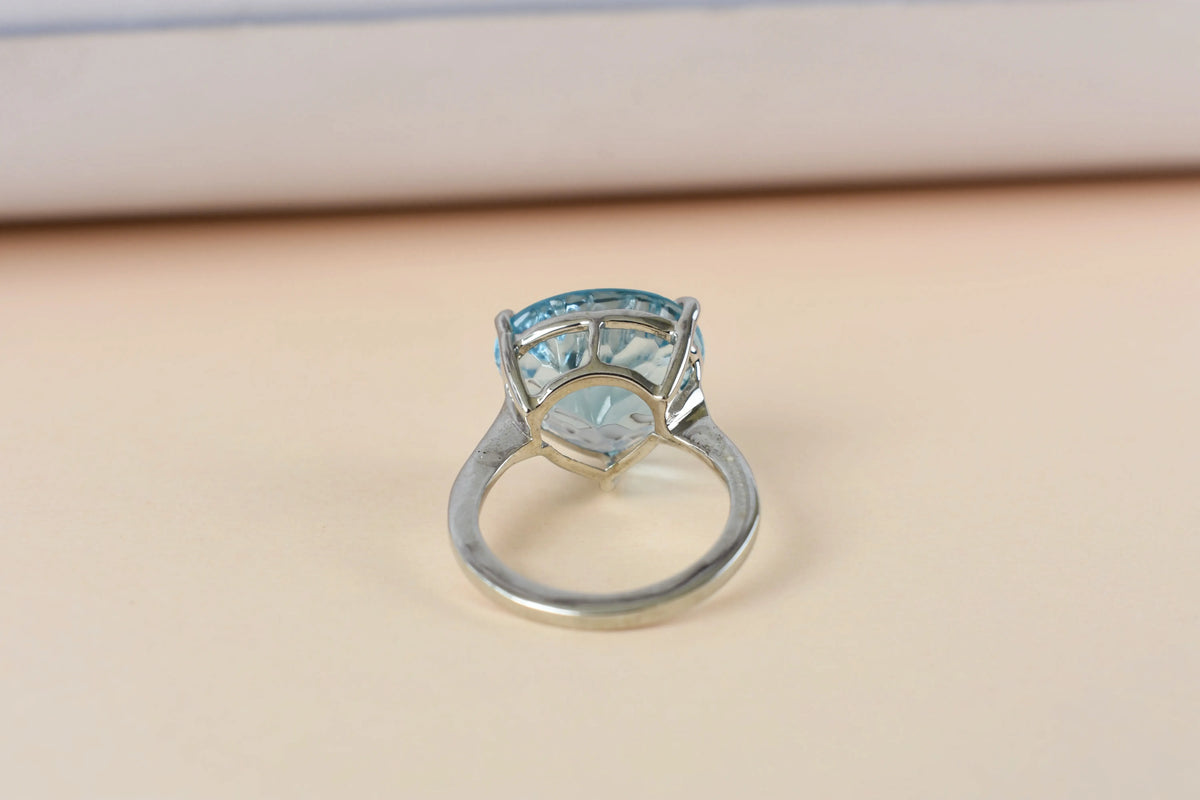 Sky blue topaz trillion-cut solitaire ring in 925 silver