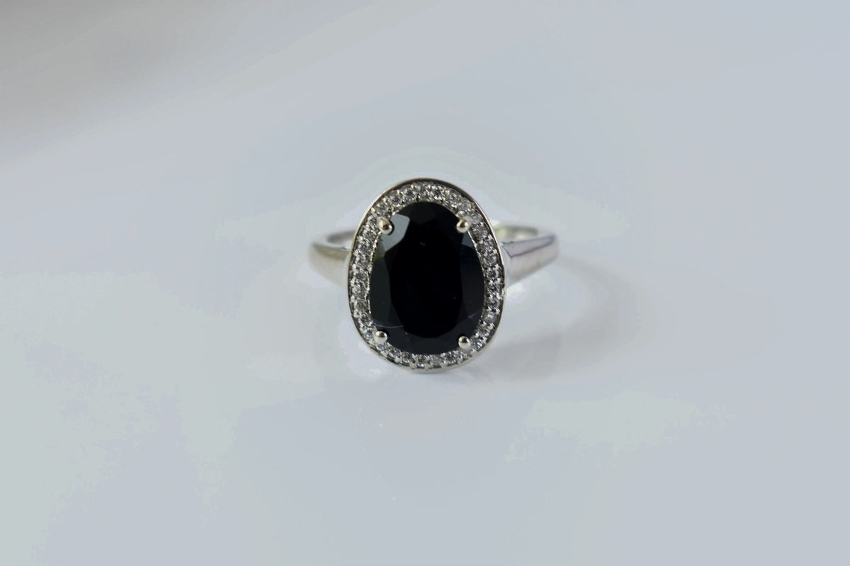 Black onyx oval halo ring in 925 silver