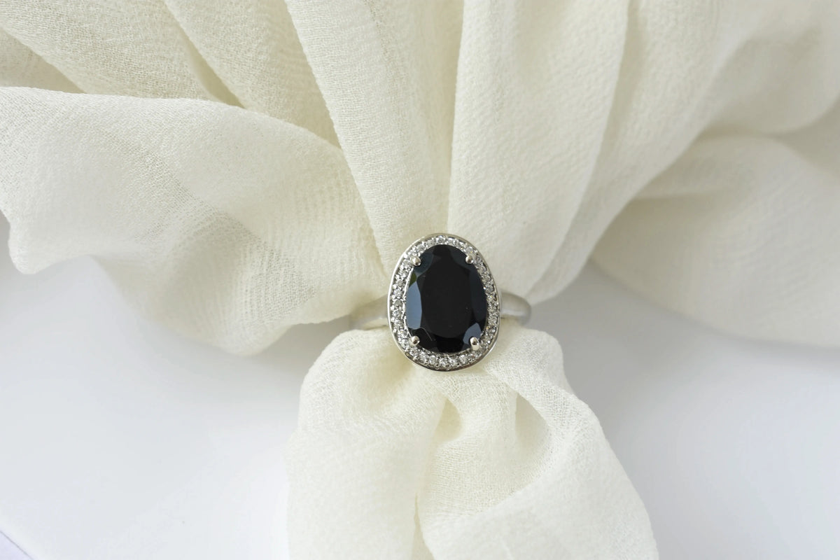 Black onyx oval halo ring in 925 silver