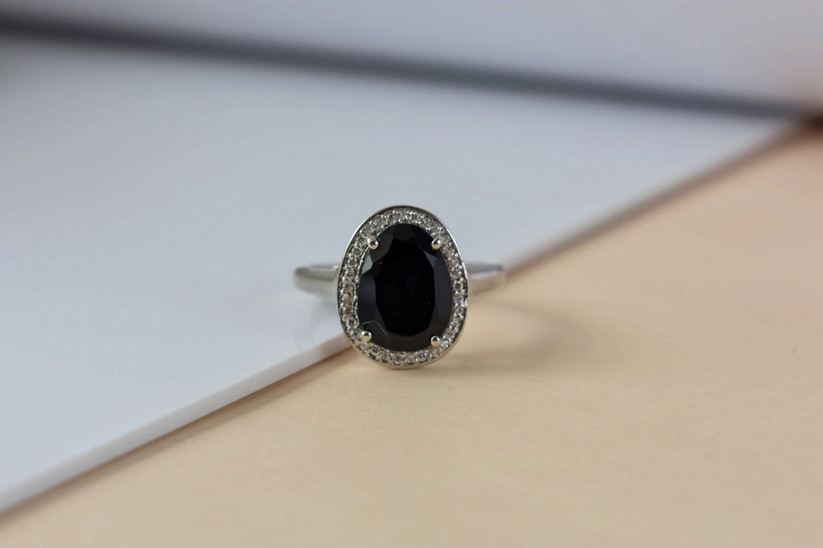 Black onyx oval halo ring in 925 silver