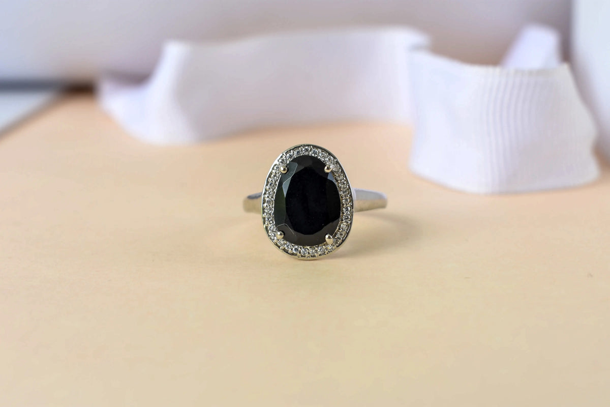 Black onyx oval halo ring in 925 silver