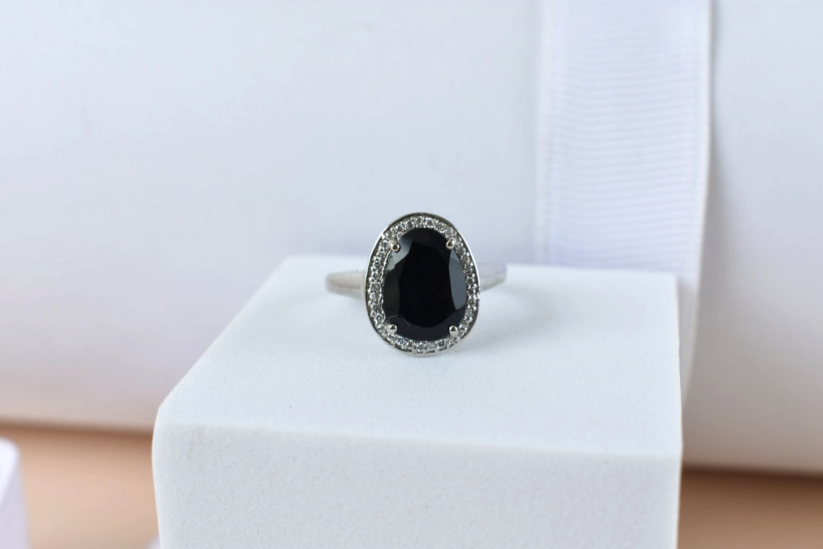Black onyx oval halo ring in 925 silver