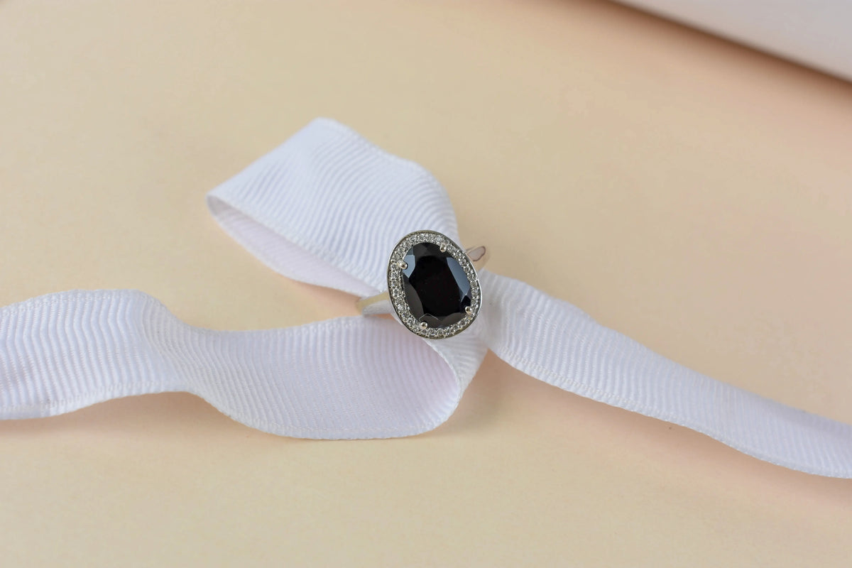 Black onyx oval halo ring in 925 silver