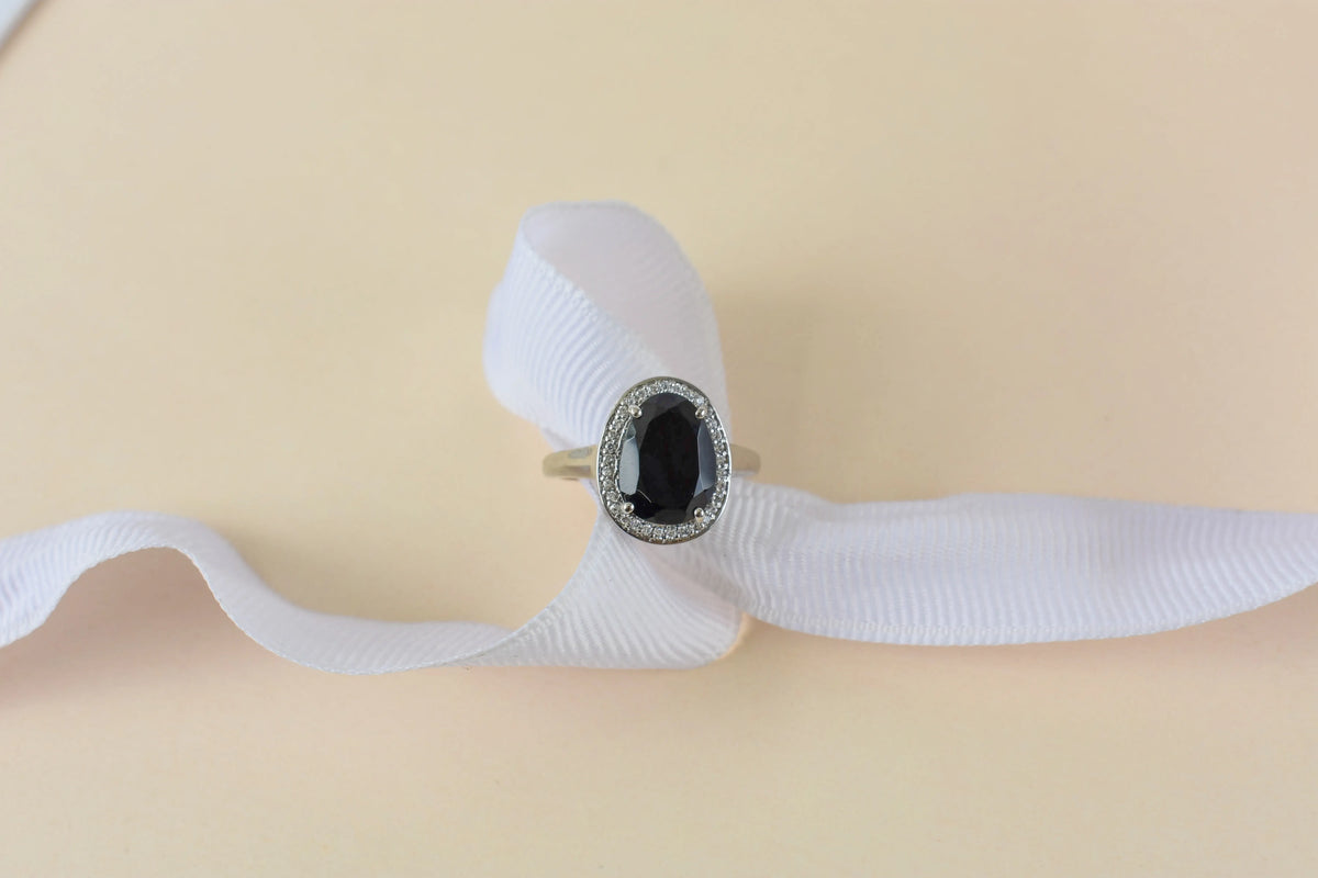 Black onyx oval halo ring in 925 silver