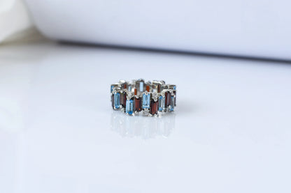 Multi gemstone baguette eternity ring with garnet and Swiss blue topaz in 925 silver