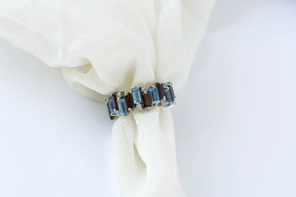 Multi gemstone baguette eternity ring with garnet and Swiss blue topaz in 925 silver