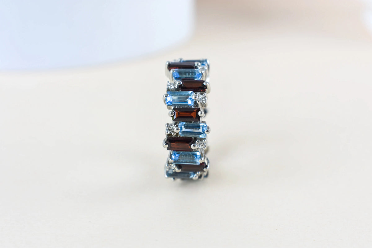 Multi gemstone baguette eternity ring with garnet and Swiss blue topaz in 925 silver