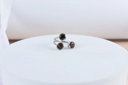 Garnet three-stone open ring in 925 silver