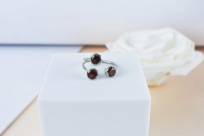 Garnet three-stone open ring in 925 silver