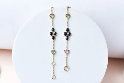 18K gold bracelet with blue sapphire clusters and multi-color trillion sapphire accents