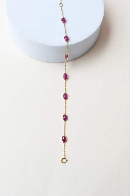 18K gold bracelet with bezel-set oval ruby stations
