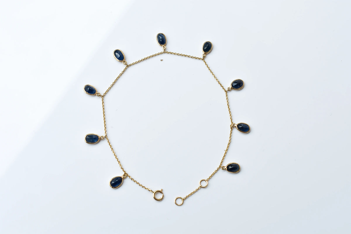 18K gold bracelet with blue sapphire drops in fringe design