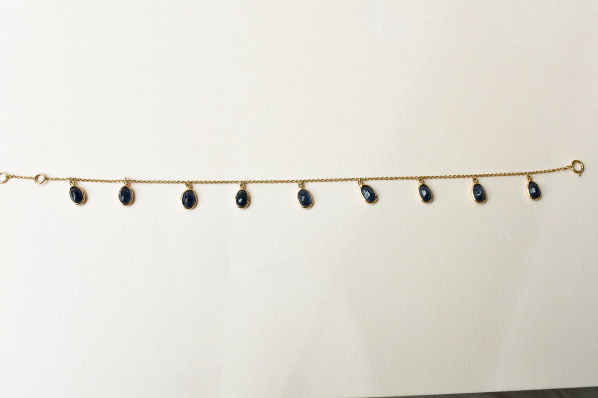 18K gold bracelet with blue sapphire drops in fringe design