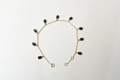 18K gold bracelet with blue sapphire drops in fringe design