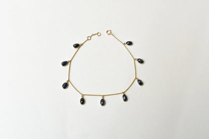 18K gold bracelet with blue sapphire drops in fringe design
