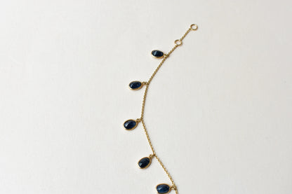 18K gold bracelet with blue sapphire drops in fringe design