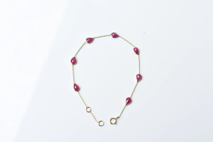 10K gold bracelet with pear-cut ruby drops