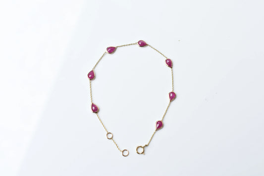 10K gold bracelet with pear-cut ruby drops