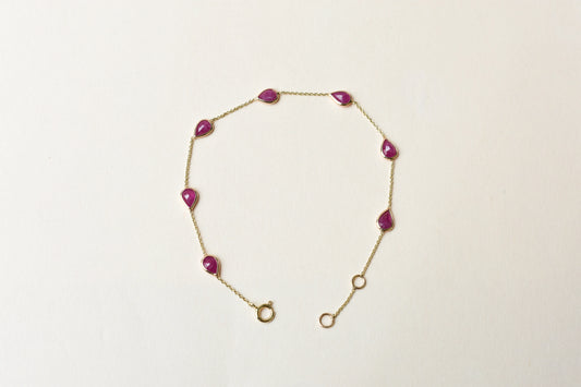 10K gold bracelet with pear-cut ruby drops
